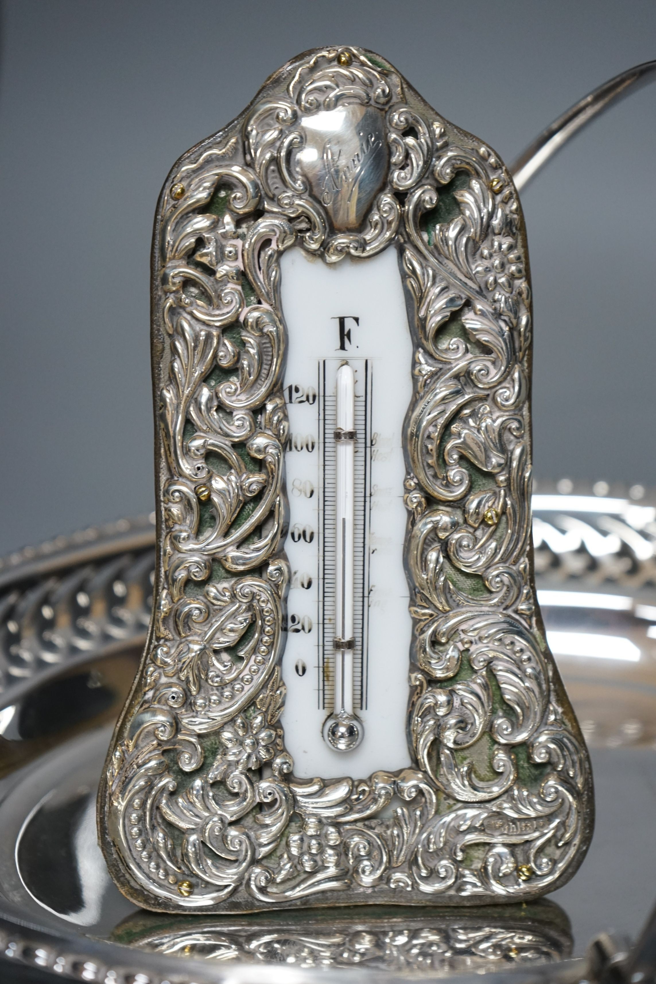 A silver-mounted Victorian thermometer, silver ashtray, plated basket stand, a small enamelled decanter and 4 matching glasses, thermometer 17.5cms high